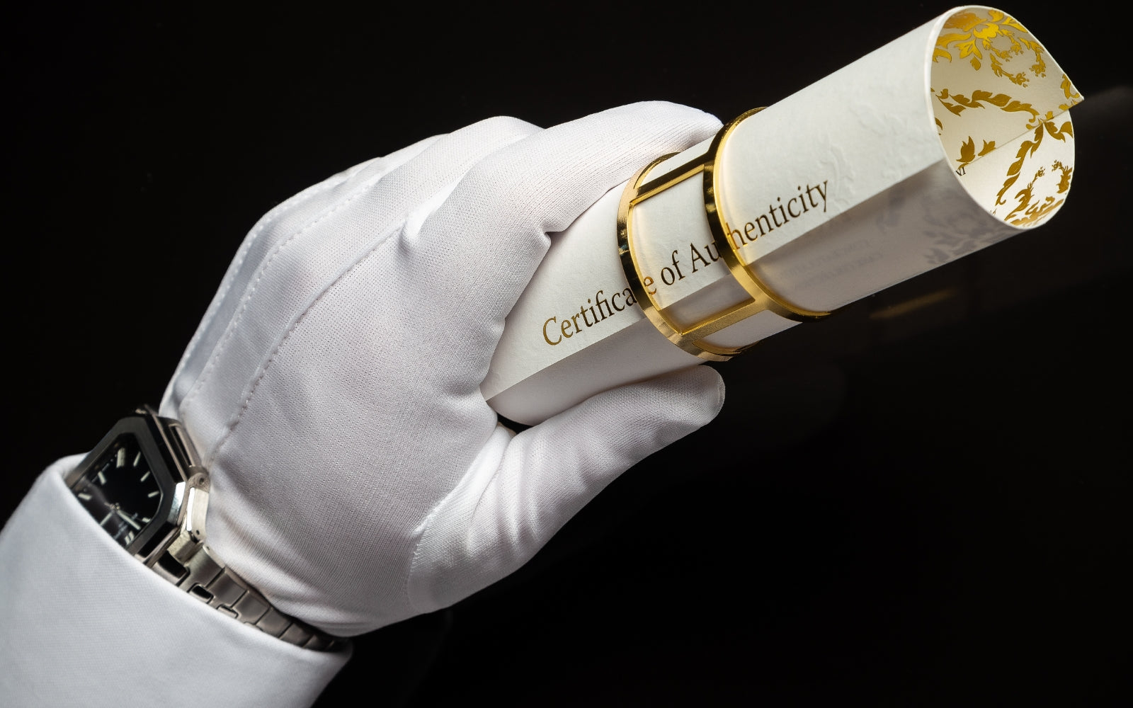 A white-gloved hand holding a Baroque Certificate of Authenticity, the provenance and trust behind a single cask. Baroque Whisky Australian Single Malt.