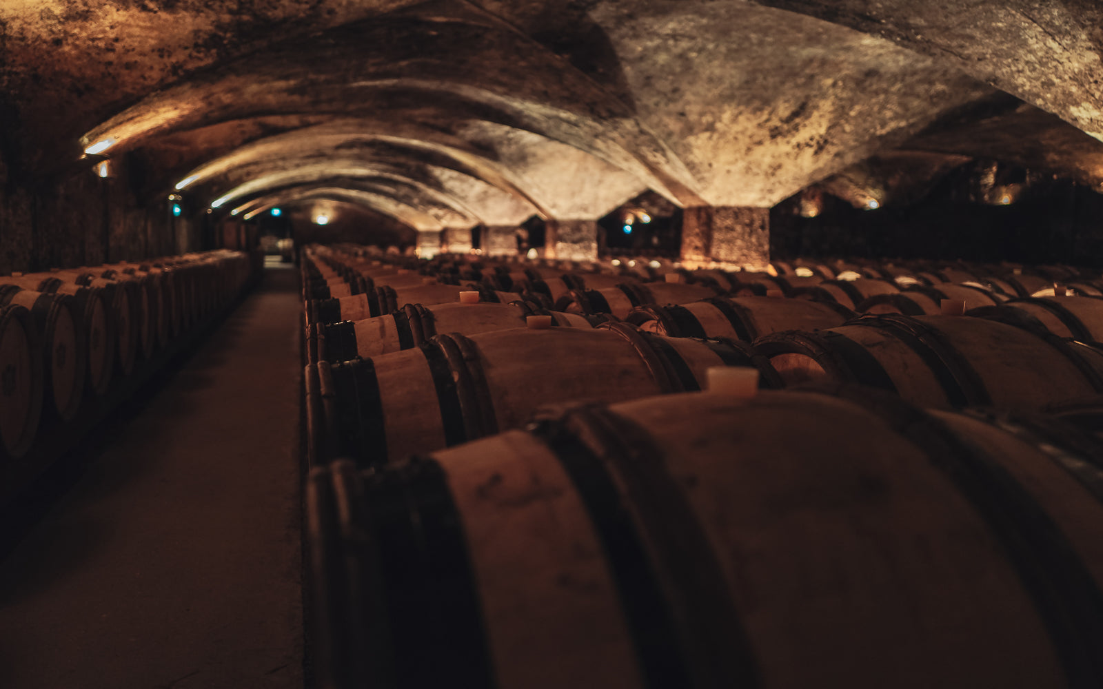 A vast wine cellar of stacked barrels, illustrating cask provenance and origin. Baroque Whisky Australian Single Malt.