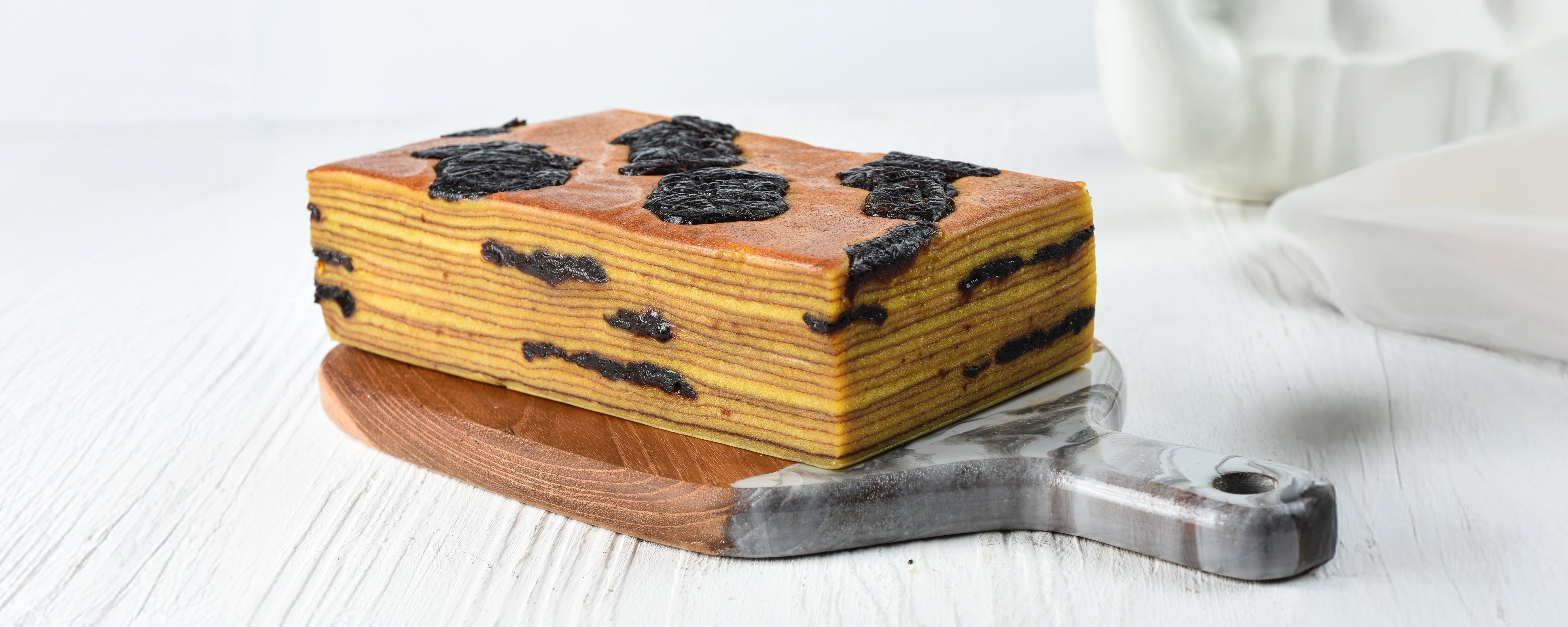Lapis legit layer cake paired with a Baroque ex-PX Manhattan, Australian Single Malt