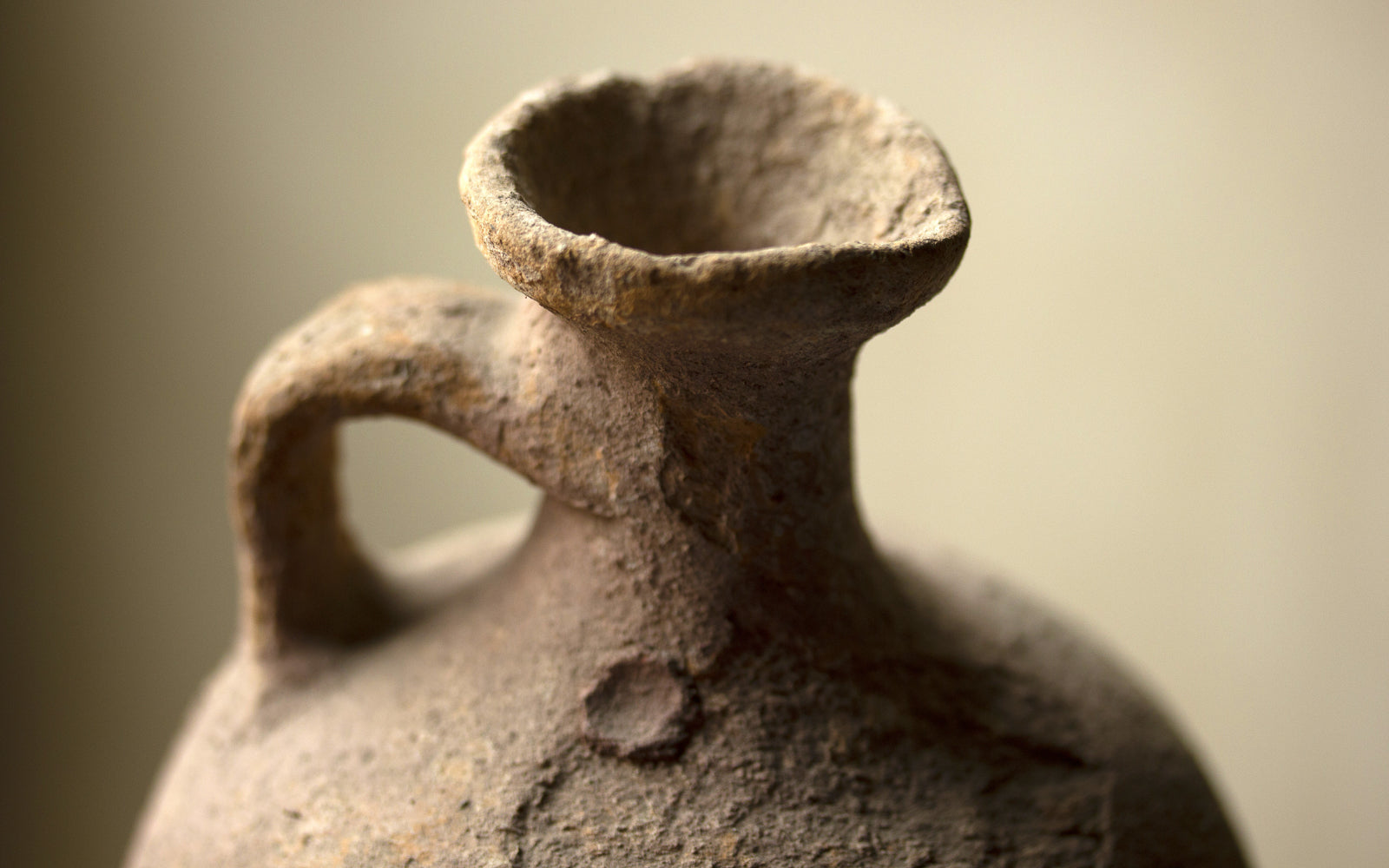 Aged terracotta vessel weathered by time, an emblem of objects that mature gracefully. Baroque Whisky.